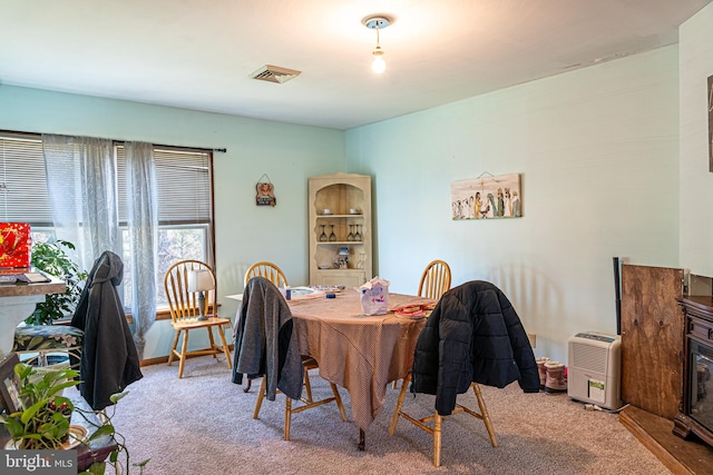 dining room featuring carpet flooring