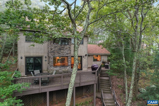 back of house featuring a deck