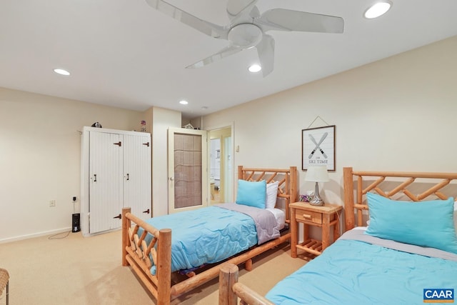 bedroom featuring ceiling fan and light colored carpet