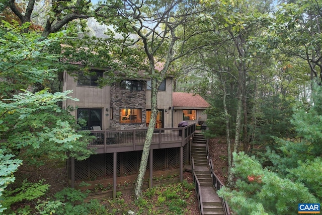 rear view of house with a wooden deck