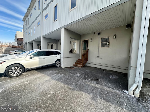 view of side of property with a carport