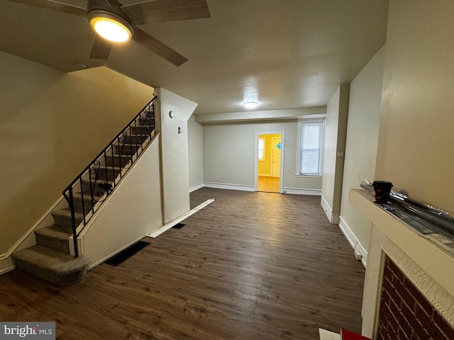 unfurnished living room featuring dark hardwood / wood-style flooring