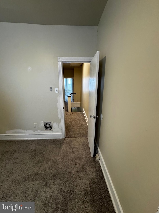 hallway featuring carpet flooring