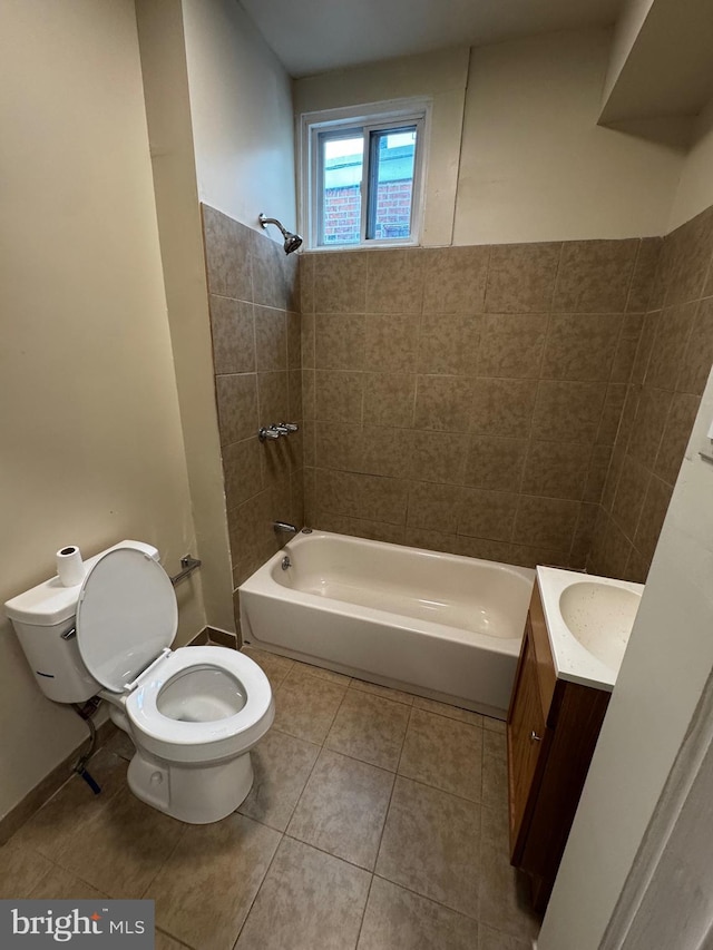 full bathroom featuring tile patterned flooring, vanity, toilet, and tiled shower / bath