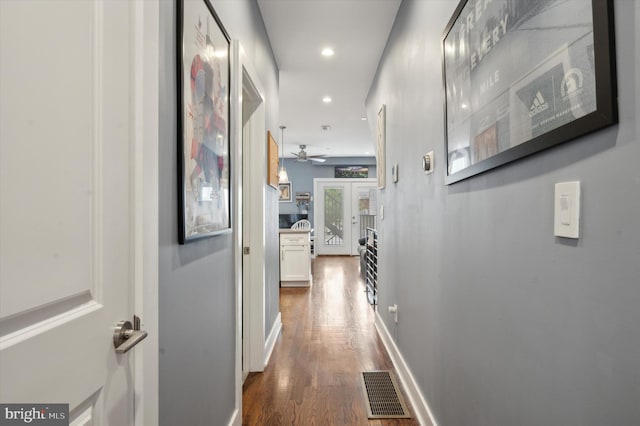 hallway with french doors and wood-type flooring