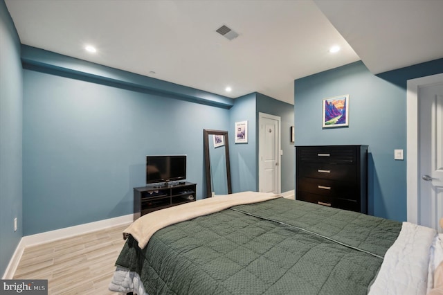 bedroom with light hardwood / wood-style flooring