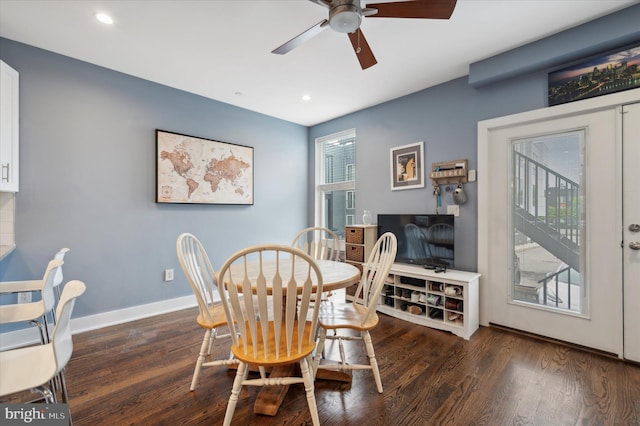 dining area with dark hardwood / wood-style flooring and ceiling fan