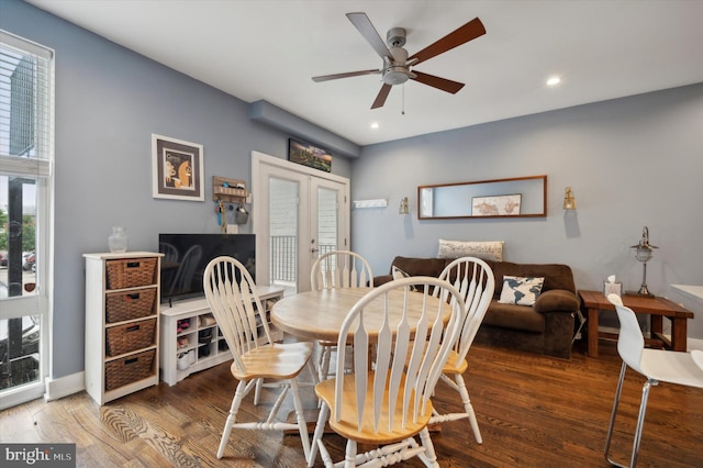 dining area featuring dark hardwood / wood-style floors, ceiling fan, and french doors