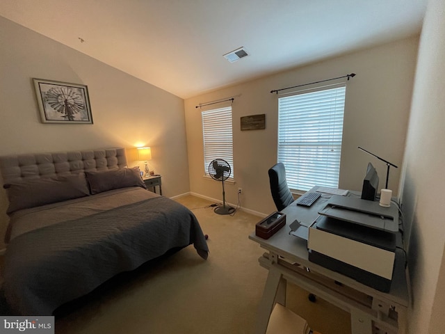 carpeted bedroom featuring vaulted ceiling