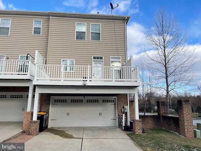 rear view of house with a garage