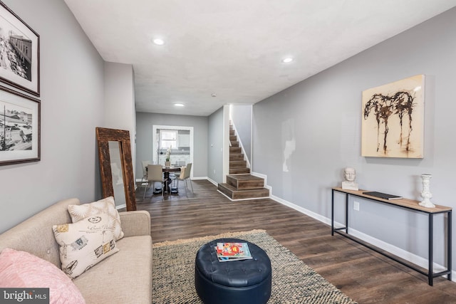 living room featuring dark wood-type flooring