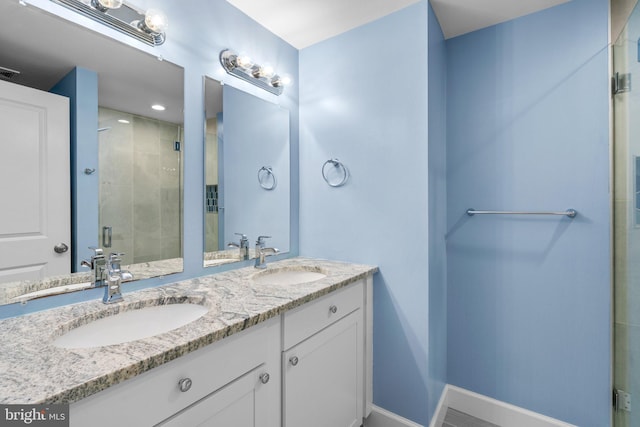 bathroom featuring vanity and walk in shower