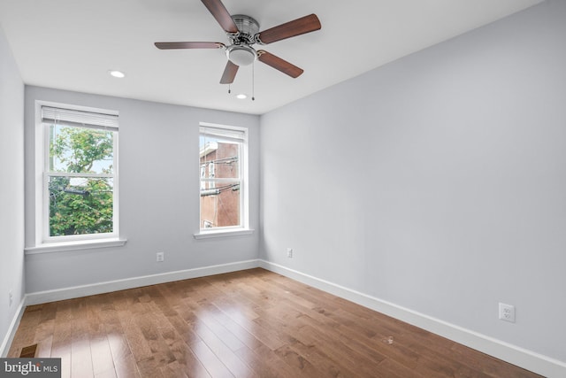 spare room featuring ceiling fan and wood-type flooring