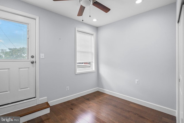 foyer featuring ceiling fan and dark hardwood / wood-style flooring