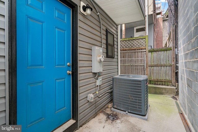 entrance to property featuring central air condition unit