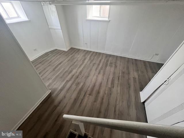 basement with dark wood-type flooring