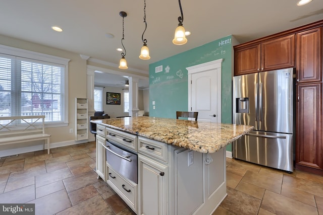 kitchen with ceiling fan, a kitchen island, stainless steel refrigerator with ice dispenser, white cabinetry, and ornate columns