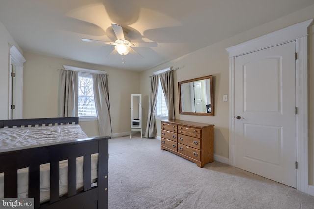 carpeted bedroom featuring ceiling fan