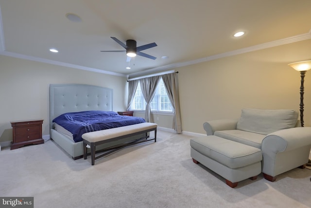 bedroom featuring light carpet, ceiling fan, and crown molding