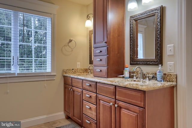 bathroom with tile patterned floors and vanity