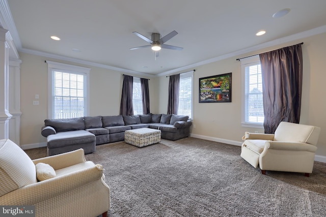 living room with ceiling fan, carpet, and ornamental molding