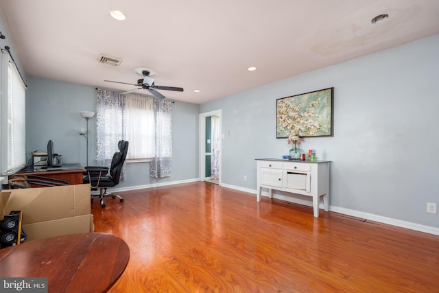 office space featuring ceiling fan and hardwood / wood-style floors