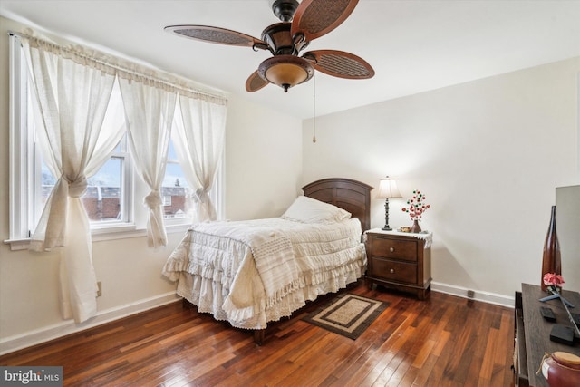 bedroom featuring dark hardwood / wood-style flooring and ceiling fan