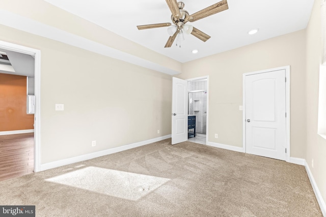 unfurnished bedroom with ceiling fan and carpet