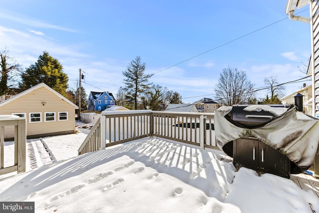 view of snow covered deck