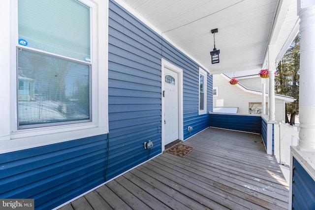 wooden terrace featuring a porch