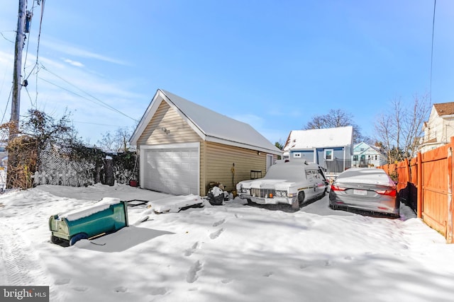 view of snow covered garage