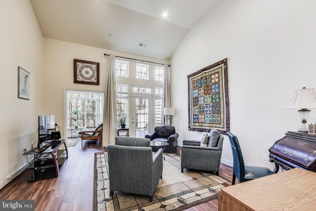 office space with hardwood / wood-style flooring and high vaulted ceiling