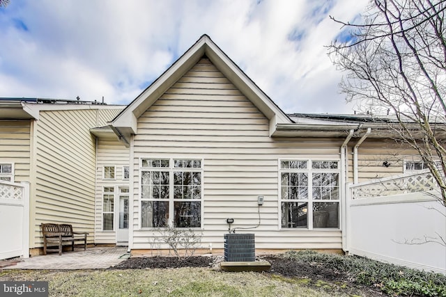 back of house with a patio area and central air condition unit