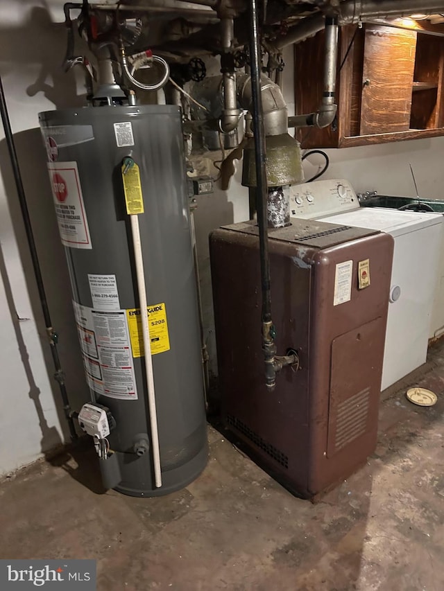 utility room with gas water heater and washer / clothes dryer