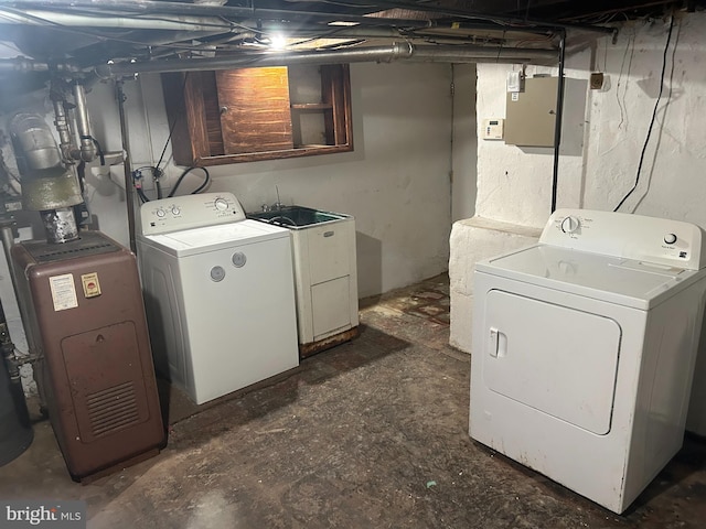 washroom with sink and independent washer and dryer