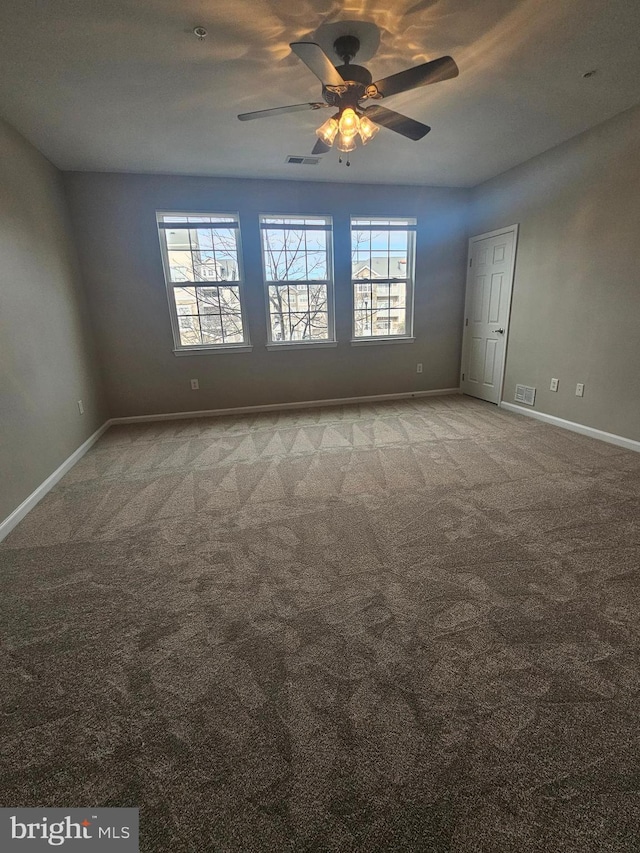 carpeted empty room with ceiling fan