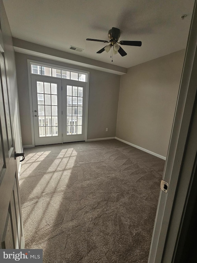 carpeted empty room with ceiling fan