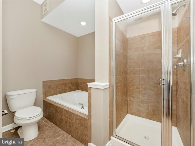 bathroom featuring tile patterned flooring, separate shower and tub, and toilet