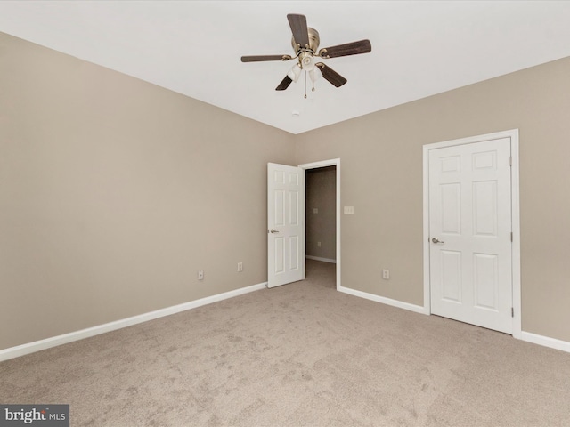 unfurnished bedroom with carpet flooring and ceiling fan