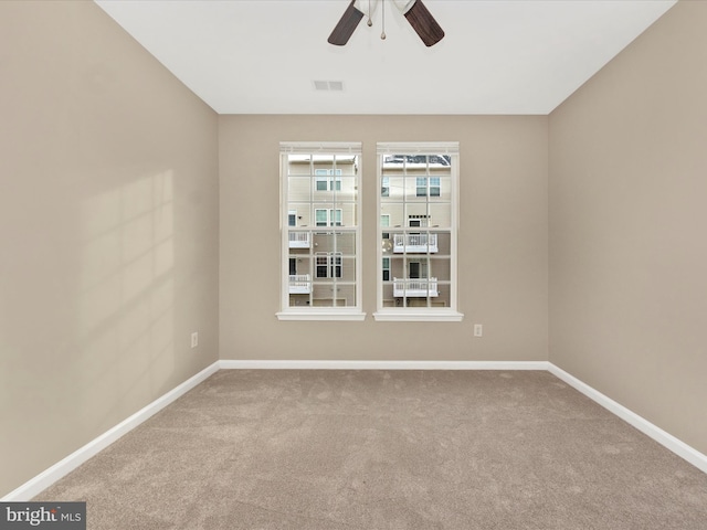 unfurnished room with carpet floors and ceiling fan