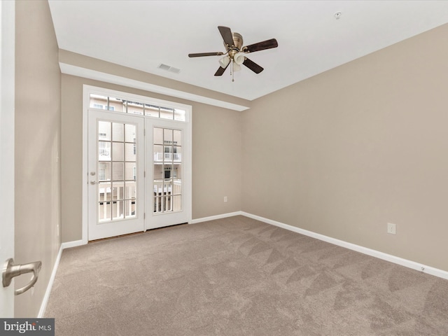 unfurnished room featuring ceiling fan and carpet floors