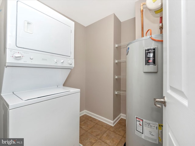 laundry room with electric water heater, stacked washing maching and dryer, and light tile patterned flooring