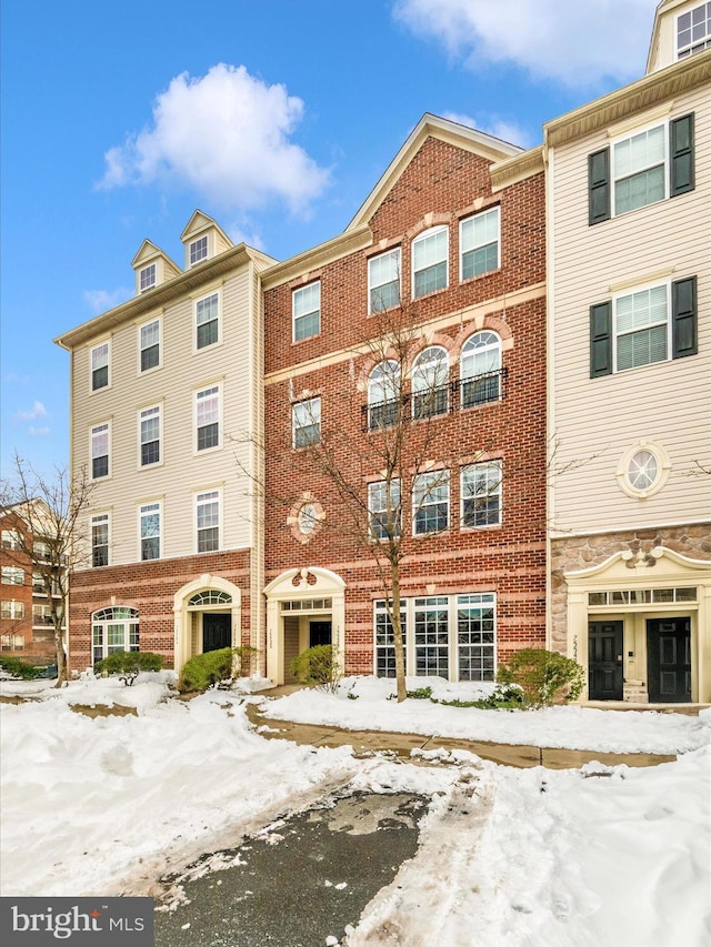 view of snow covered property