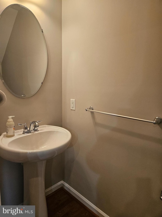 bathroom featuring sink and wood-type flooring