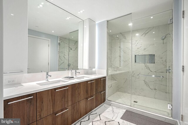 bathroom with vanity and a shower with shower door