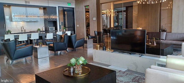 building lobby featuring a sink and visible vents