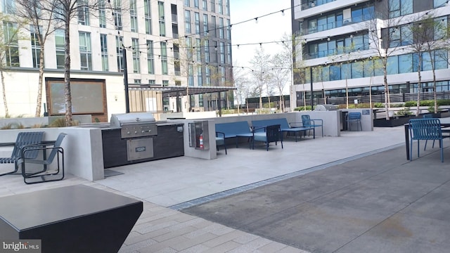 view of patio / terrace featuring grilling area, outdoor lounge area, and exterior kitchen