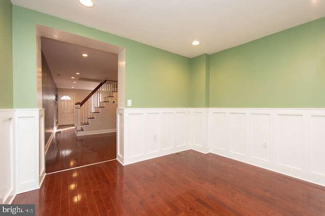 empty room featuring dark hardwood / wood-style flooring