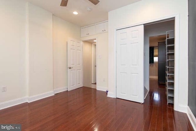 unfurnished room featuring ceiling fan and dark hardwood / wood-style floors