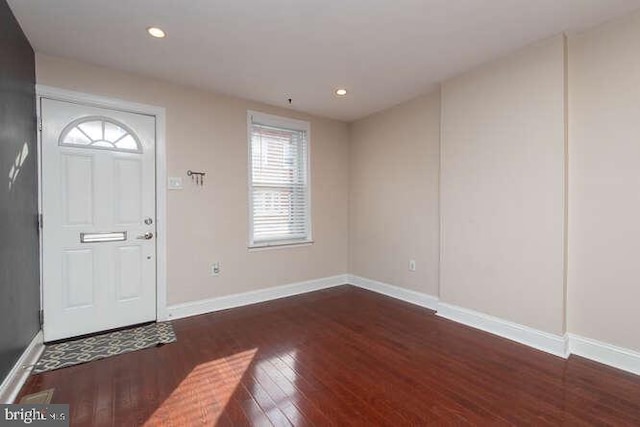 foyer entrance with dark hardwood / wood-style flooring